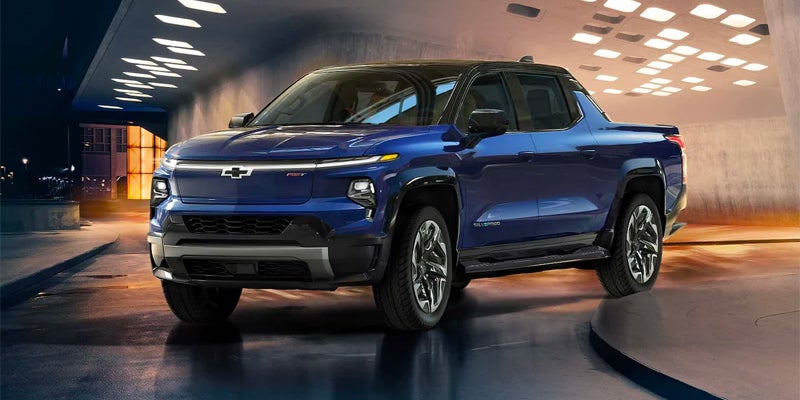 Blue Silverado EV Driving in building