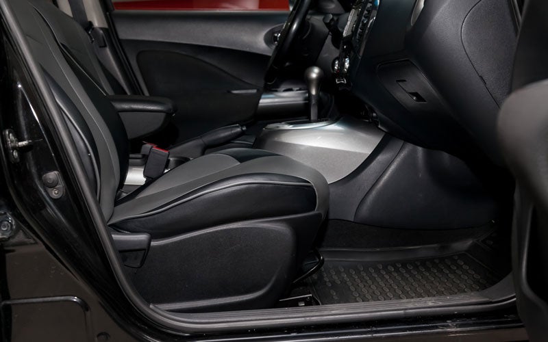 Black seats and floor mats of car
